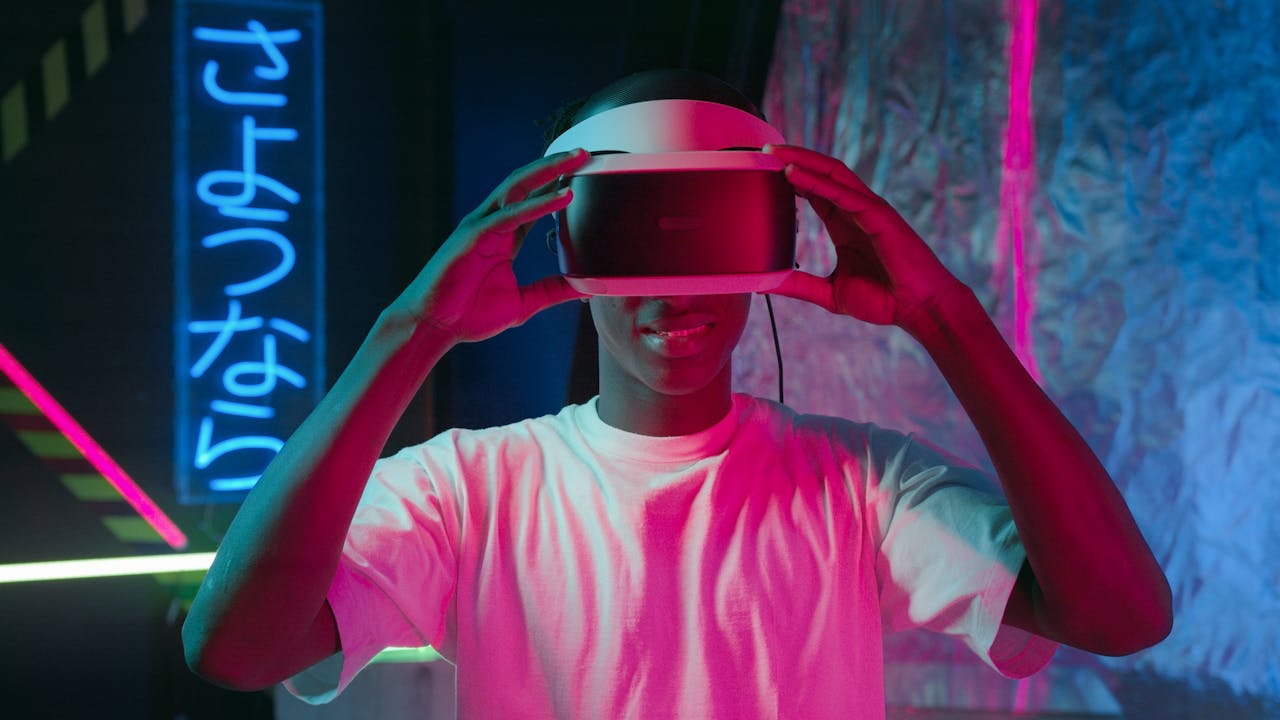 our-story A person enjoying virtual reality surrounded by vibrant neon lights, creating a futuristic experience.